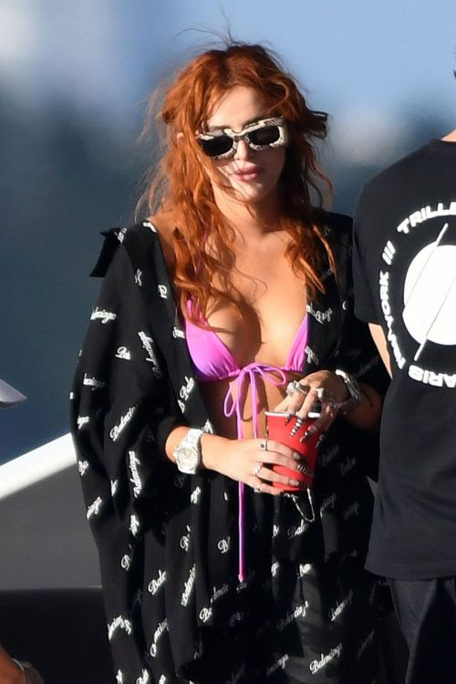 Bella Thorne Flashes Her Cleavage in Violet Bikini as She Enjoys at a Boat in Miami Beach 03/11/2021 9
