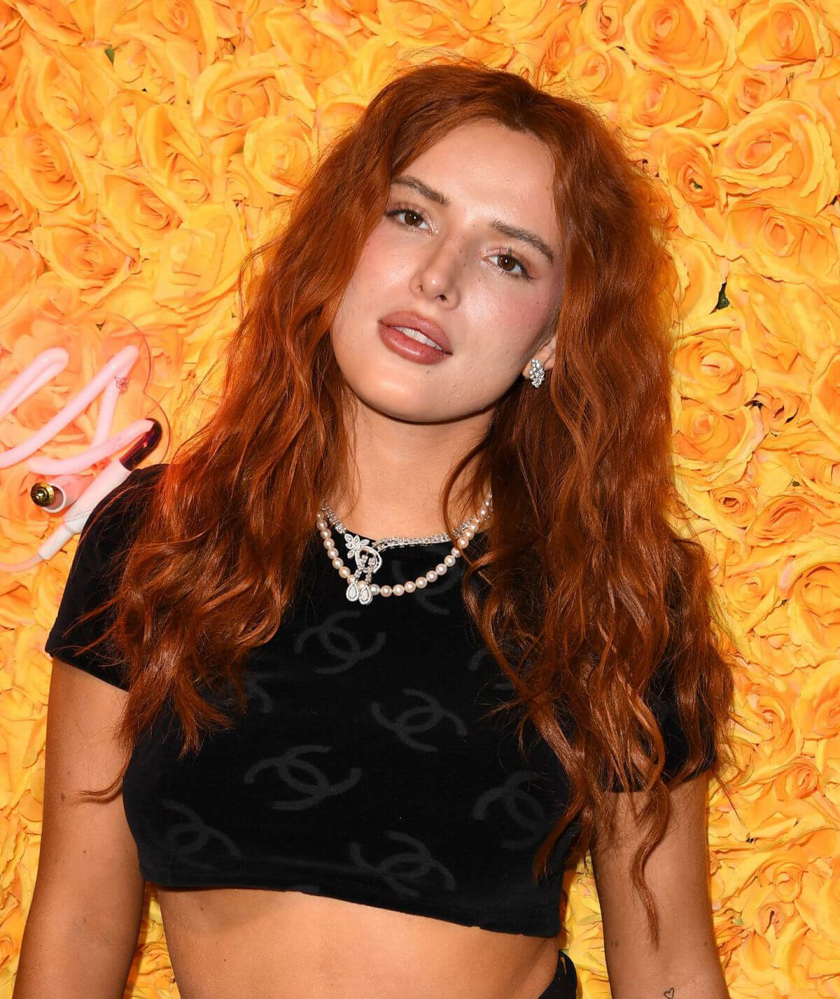 Bella Thorne Flashes Her Toned Midriff in Crop Top as She Hosts DJ Set and Listening Party at Sugar Factory in Miami 03/11/2021 1