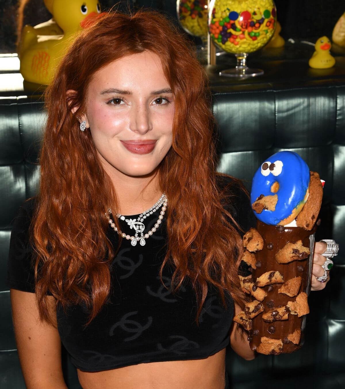 Bella Thorne Flashes Her Toned Midriff in Crop Top as She Hosts DJ Set and Listening Party at Sugar Factory in Miami 03/11/2021 6