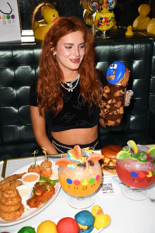 Bella Thorne Flashes Her Toned Midriff in Crop Top as She Hosts DJ Set and Listening Party at Sugar Factory in Miami 03/11/2021 7