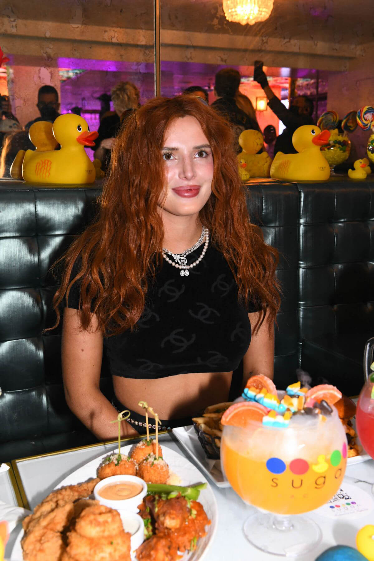 Bella Thorne Flashes Her Toned Midriff in Crop Top as She Hosts DJ Set and Listening Party at Sugar Factory in Miami 03/11/2021 8