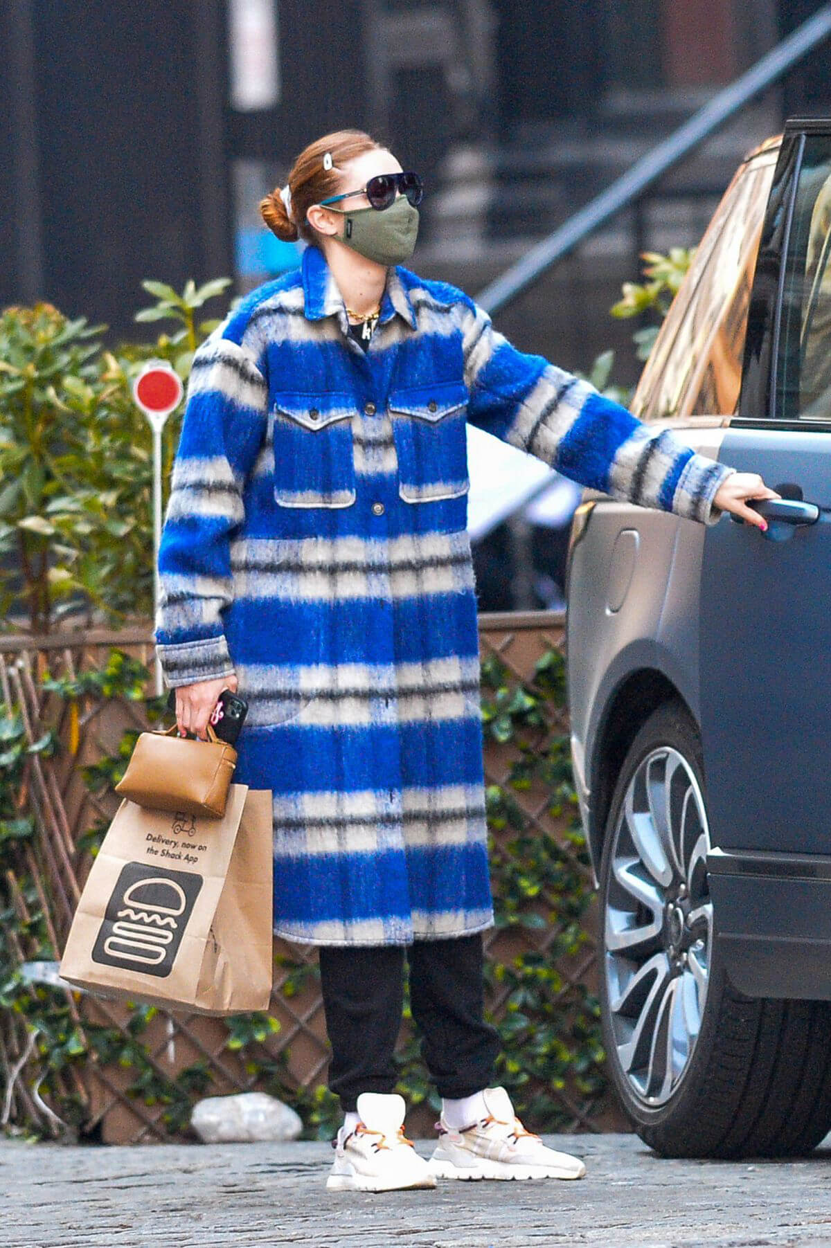 Gigi Hadid in Long Overcoat Leaving Shake Shack in New York 03/11/2021