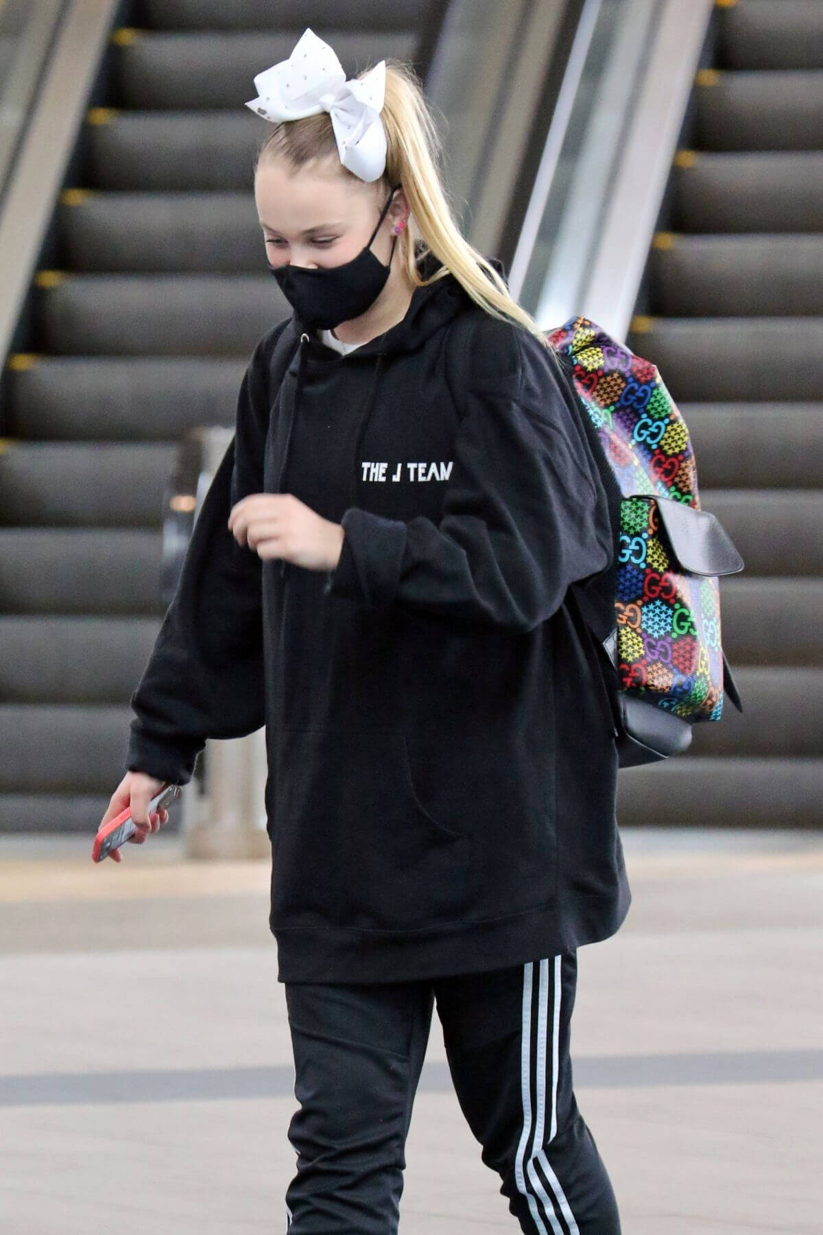 JoJo Siwa in Hoodie Arrives at Airport in Vancouver 03/20/2021