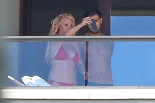 Britney Spears in Red Bikini with her boyfriend Sam Asghari at a Hotel Balcony in Hawaii 06/30/2021 2