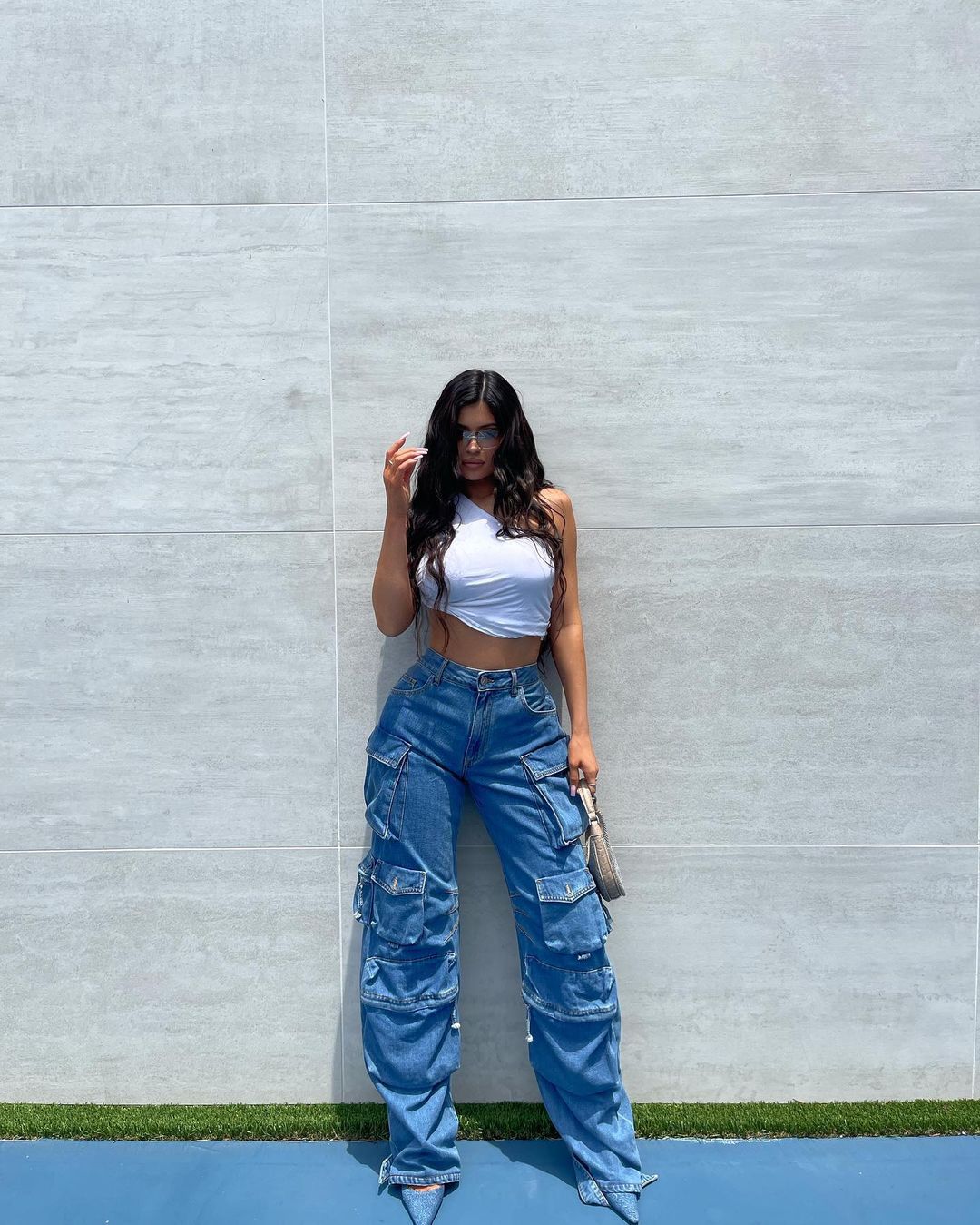 Kylie Jenner Photoshoot in White Crop Top and Multi-Pocket Jeans 06/30/2021