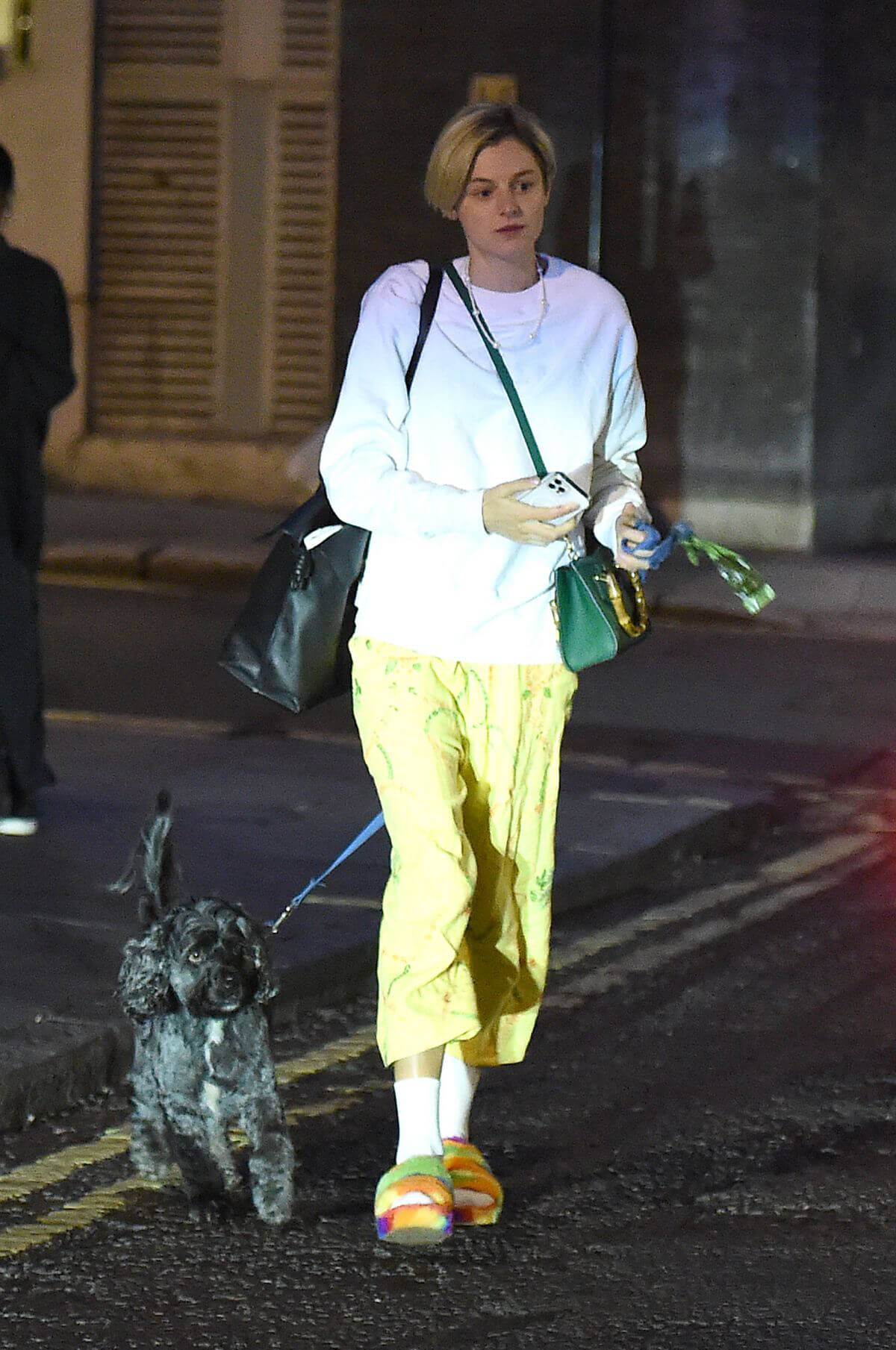 Emma Corrin Leaves with Her Dog at Harold Pinter Theatre in London 08/02/2021