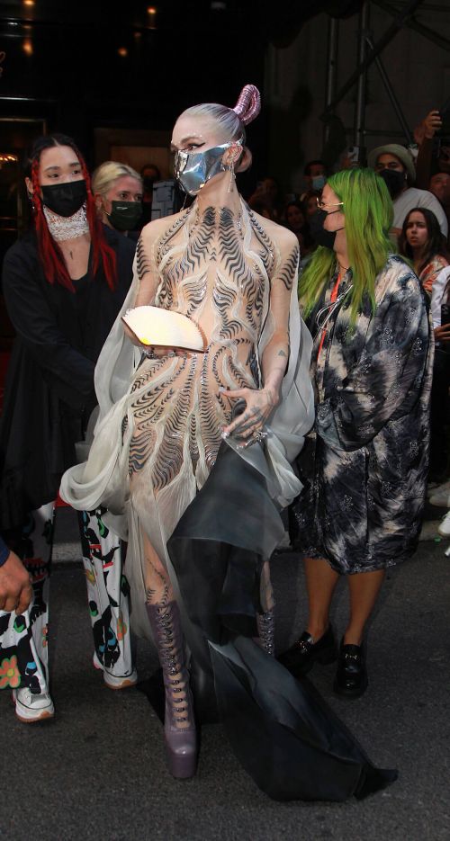 Grimes wears Metal Mask to 2021 Met Gala in New York 09/13/2021 1