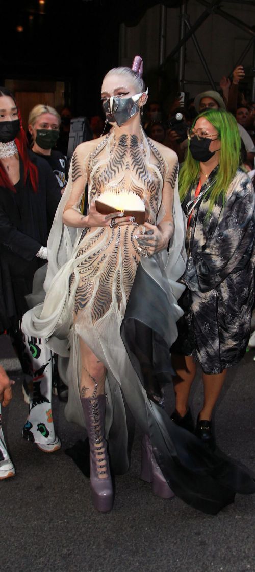 Grimes wears Metal Mask to 2021 Met Gala in New York 09/13/2021 2