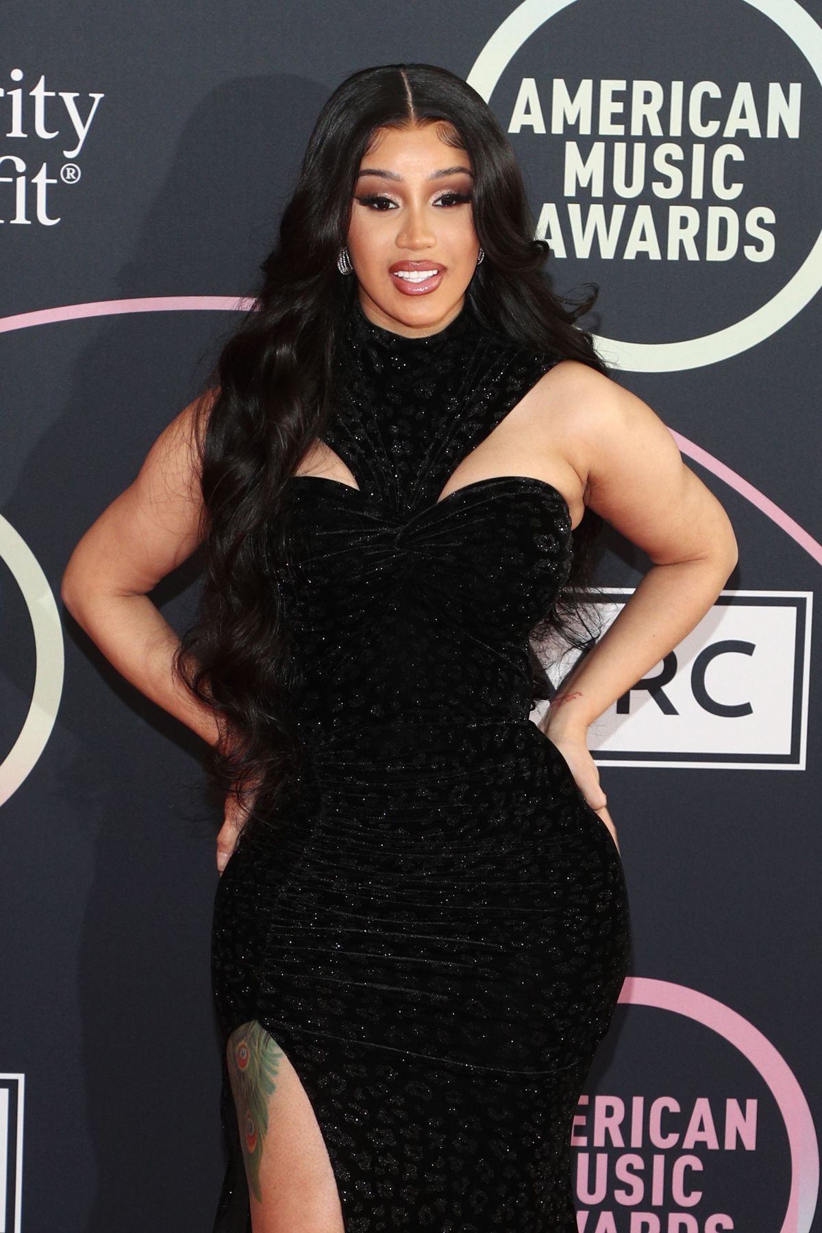 Cardi B seen in Black Dress attends 2021 American Music Awards in Los Angeles 11/19/2021