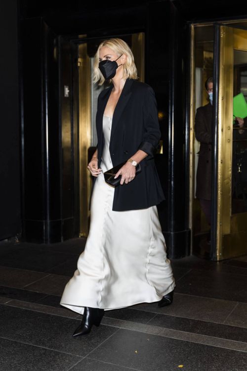 Charlize Theron in Black Jacket with White Silk Gown Leaves Her Hotel in New York 11/18/2021 2