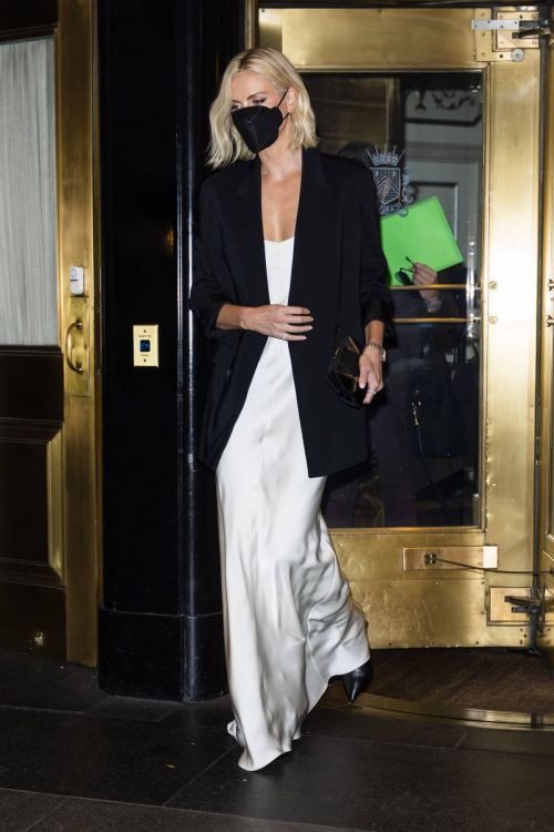 Charlize Theron in Black Jacket with White Silk Gown Leaves Her Hotel in New York 11/18/2021 6