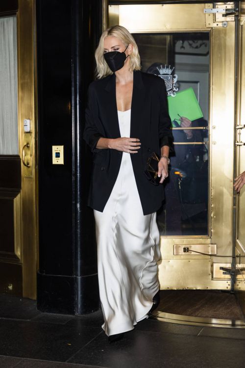 Charlize Theron in Black Jacket with White Silk Gown Leaves Her Hotel in New York 11/18/2021 2