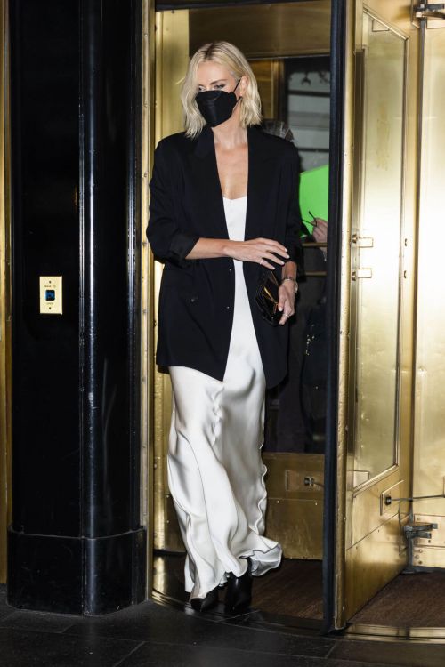 Charlize Theron in Black Jacket with White Silk Gown Leaves Her Hotel in New York 11/18/2021 3