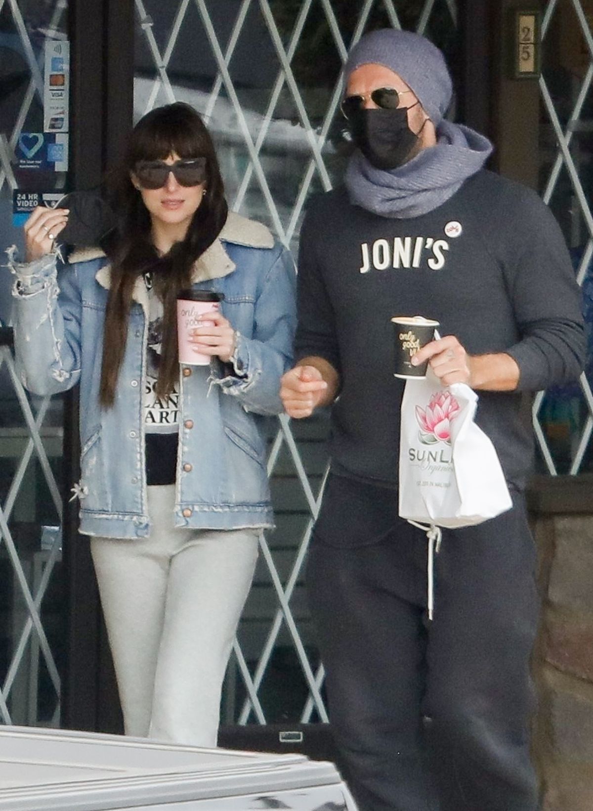 Dakota Johnson and Chris Martin Out at SunLife Organics in Malibu 10/31/2021