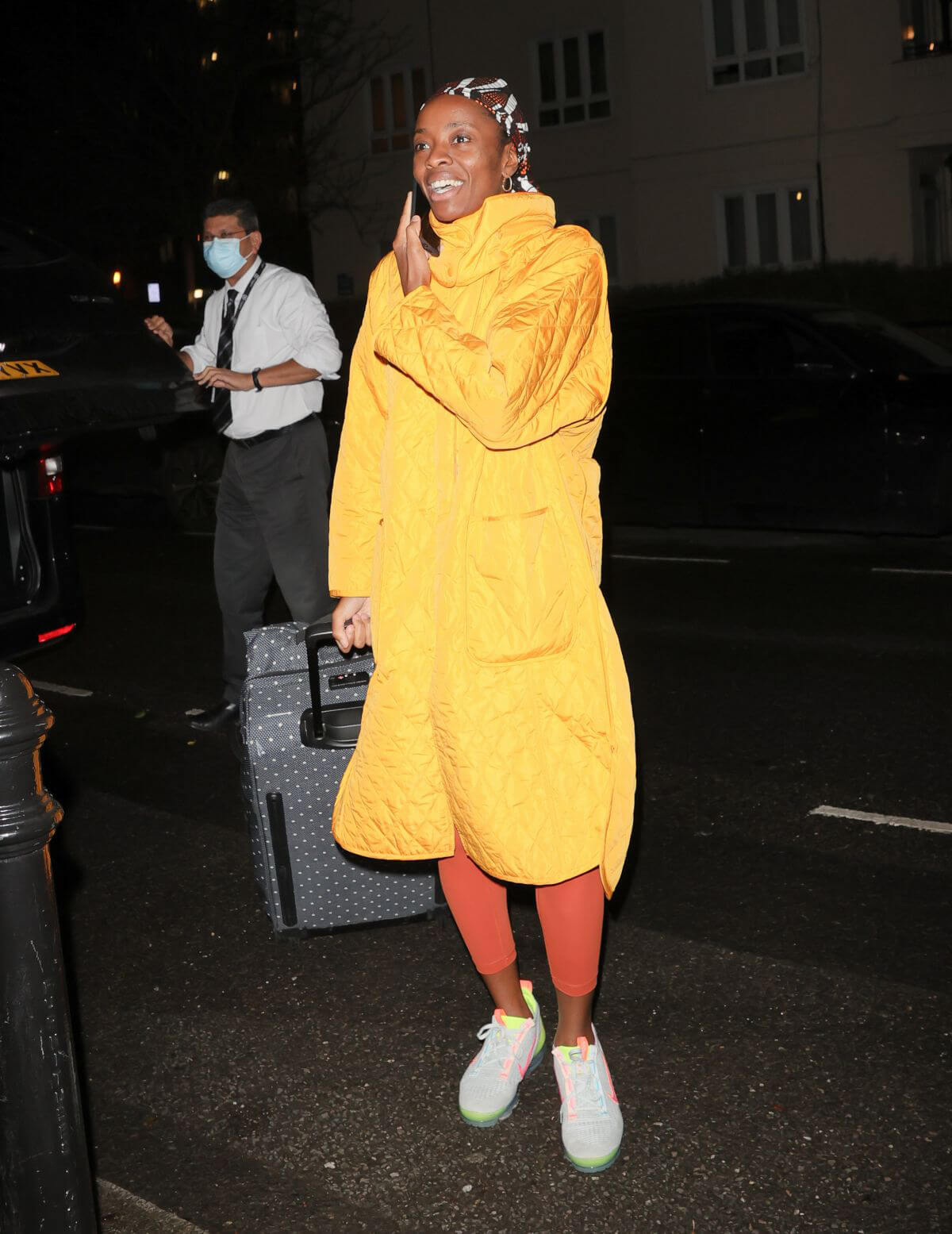 AJ Odudu seen in Yellow Long Coat Night Out in London 12/06/2021