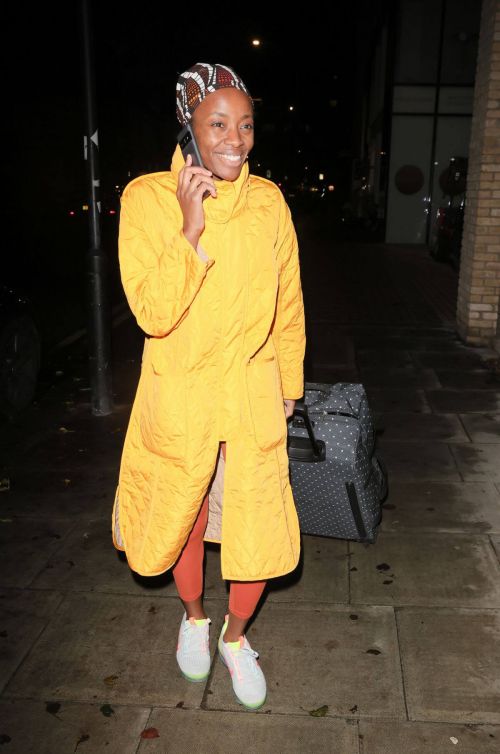 AJ Odudu seen in Yellow Long Coat Night Out in London 12/06/2021 1