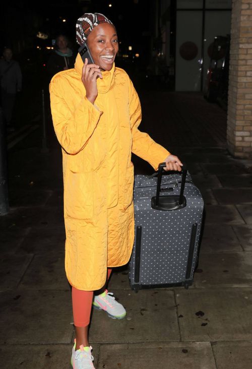 AJ Odudu seen in Yellow Long Coat Night Out in London 12/06/2021