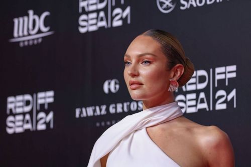 Candice Swanepoel seen in White Outfit at Red Sea Film Festival 12/06/2021