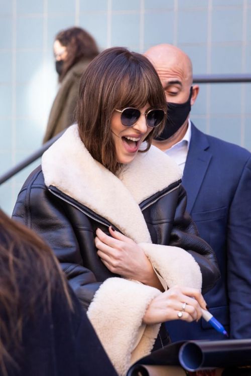 Dakota Johnson in Shearling Jacket and flashes her Legs Day Out in New York