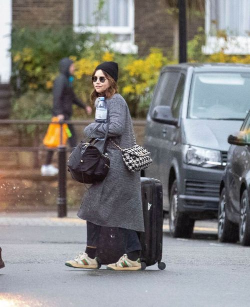 Jenna Coleman in Grey Coat with Watch Hat Out in London
