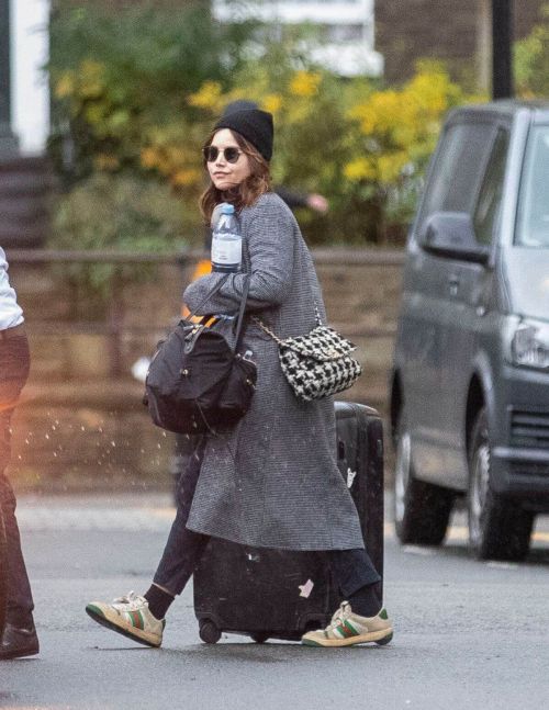 Jenna Coleman in Grey Coat with Watch Hat Out in London