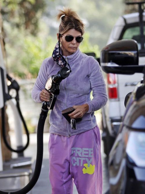 Lori Loughlin seen in FREE CITY Track Paints at a Gas Station in Los Angeles 11/19/2021 2