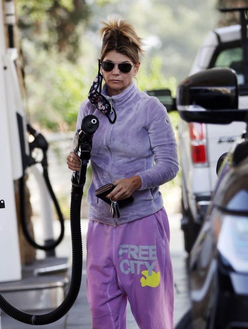 Lori Loughlin seen in FREE CITY Track Paints at a Gas Station in Los Angeles 11/19/2021