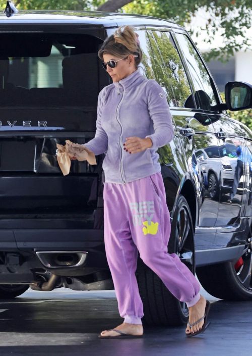 Lori Loughlin seen in FREE CITY Track Paints at a Gas Station in Los Angeles 11/19/2021 6