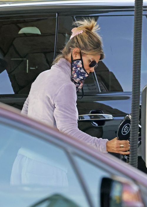 Lori Loughlin seen in FREE CITY Track Paints at a Gas Station in Los Angeles 11/19/2021 9
