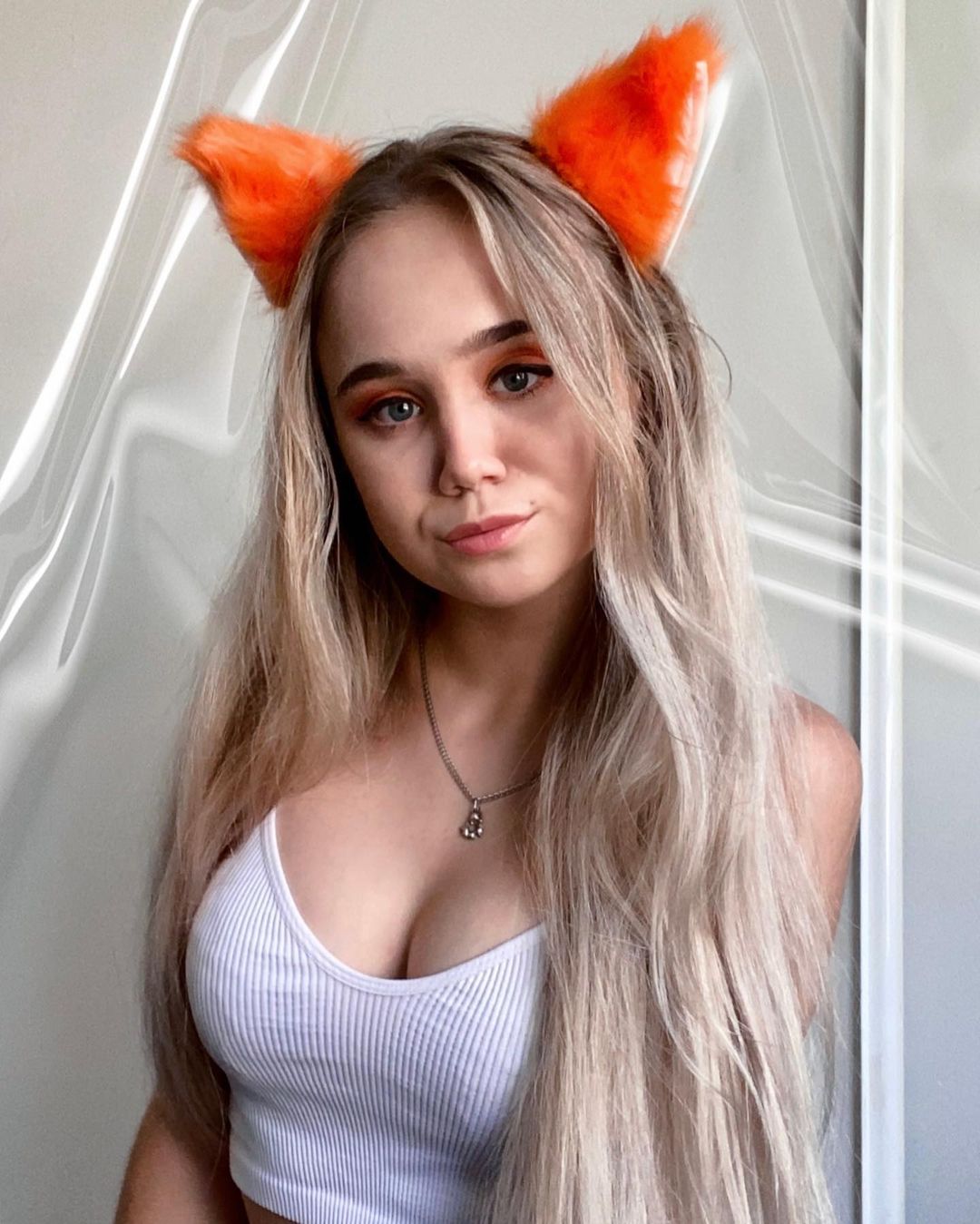 Alisa Goldfinch in White Tank Top with Fox Hairband - Instagram Photos, December 2021