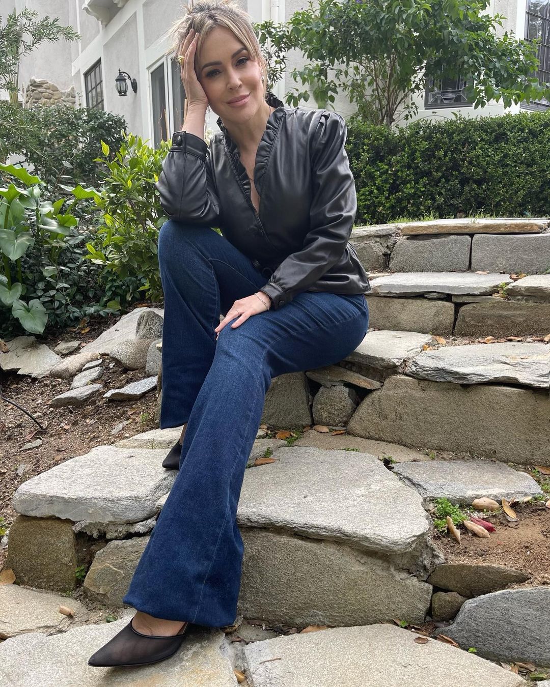 Alyssa Milano wears Rouje Paris Black Top and L'AGENCE Denim, January 2022