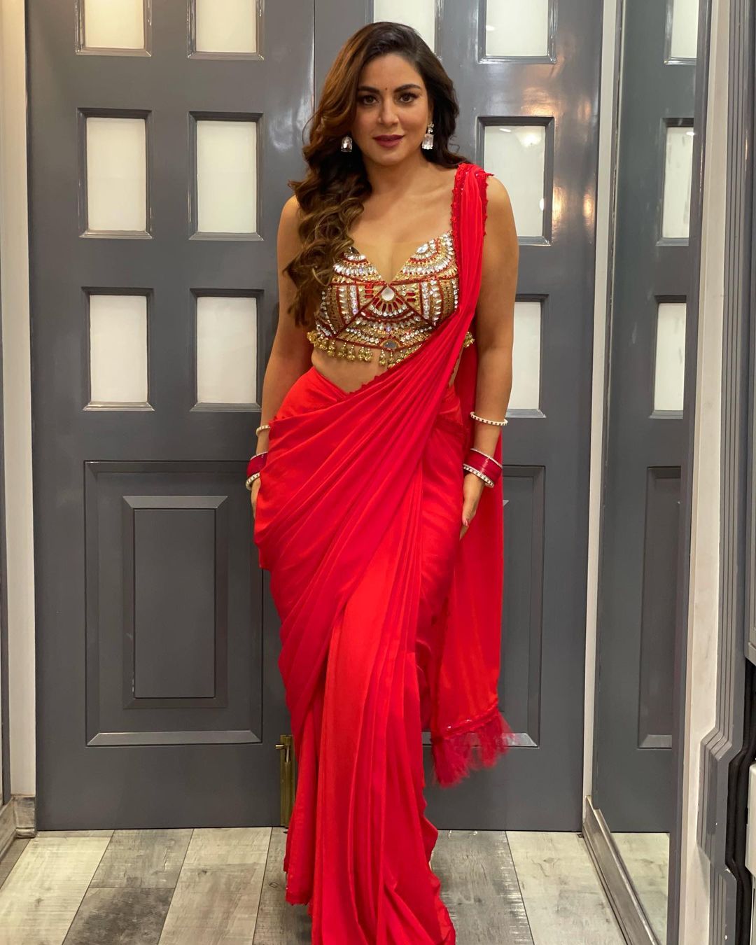 Shraddha Arya wears a Deep Neck Blouse Red Saree Designed by Harshal Naik, January 2022