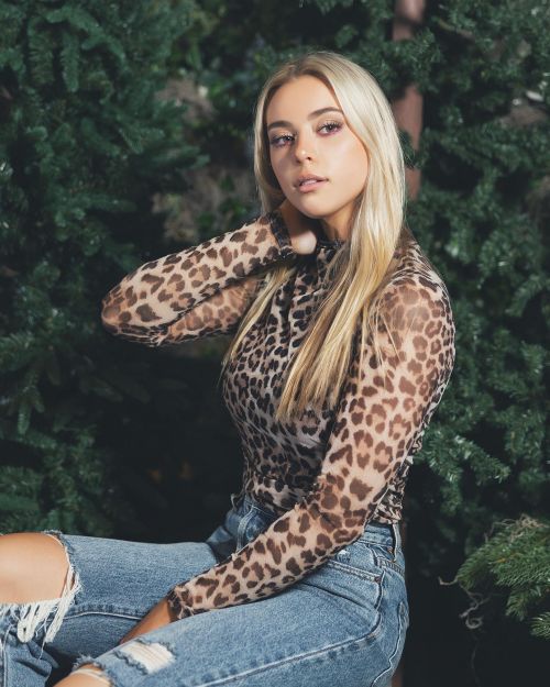 Morgan Raine wore a Animal Print Top and Denim in Photoshoot at Texas 1