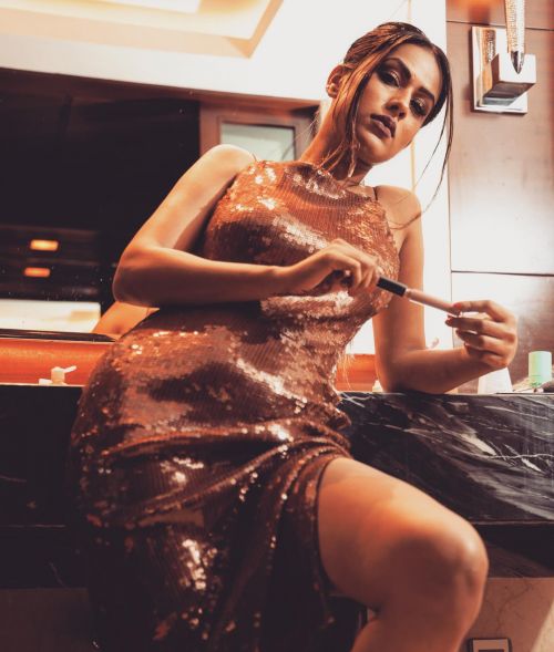 Nia Sharma Poses in Sparkling Brown Gown, March 2022