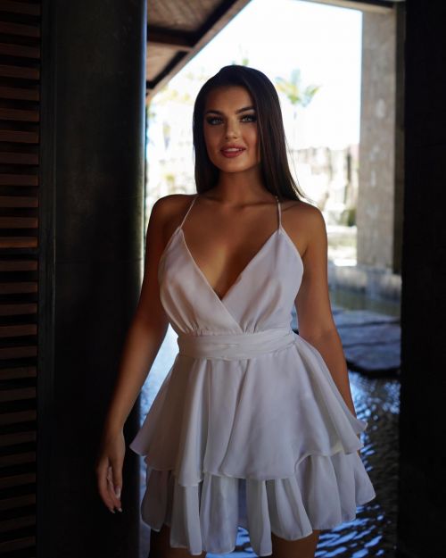 Valeria Vasilieva poses in White Short Dress at TS Suites Seminyak Hotel at Bali 1