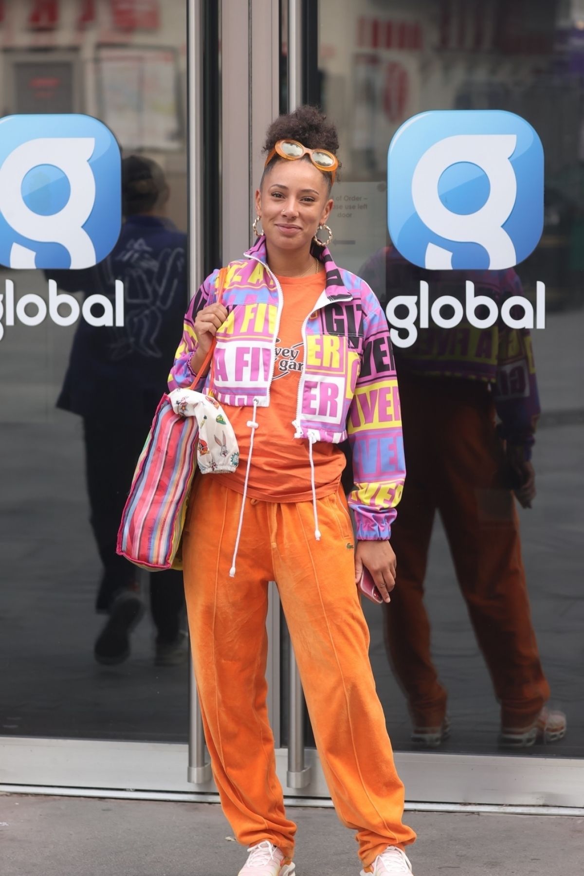 Eliza Rose in Orange Lower with Typography Jacket After Leaves Heart Radio in London