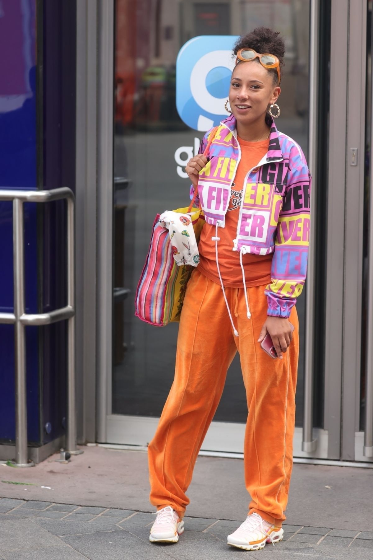 Eliza Rose in Orange Lower with Typography Jacket After Leaves Heart Radio in London 3