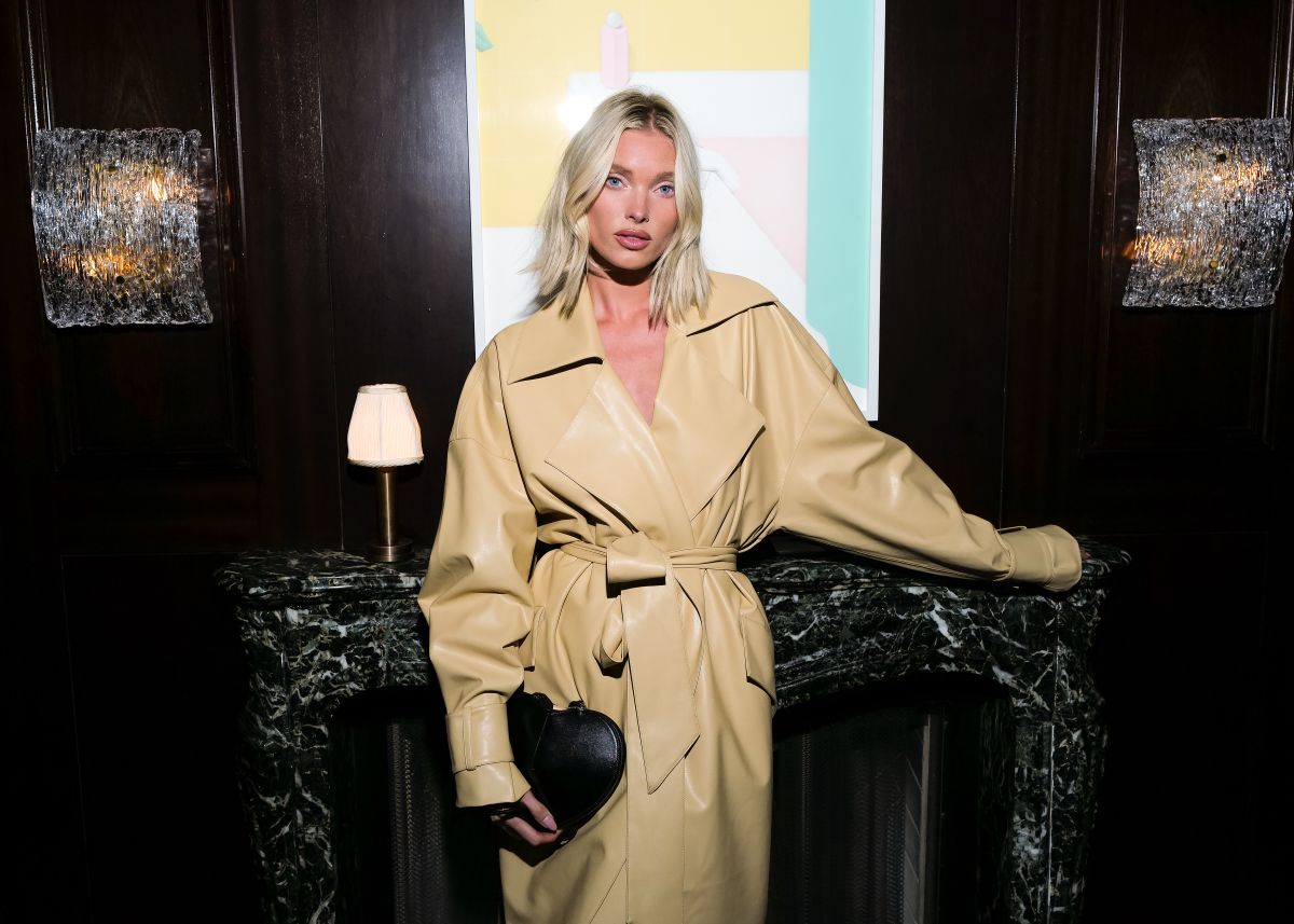 Elsa Hosk in Faux Leather Trench Coat at Revolve Gallery Designer Fete in New York