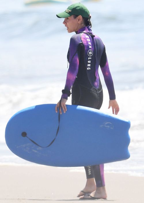Mila Kunis in Purple Wetsuit at a Beach in Santa Barbara 5