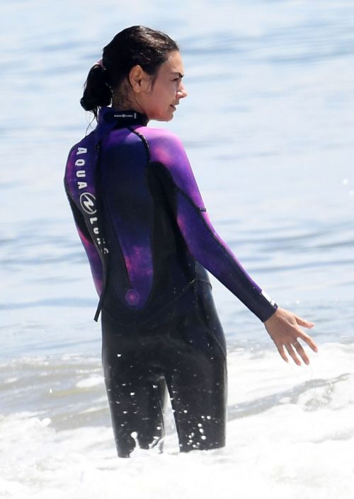 Mila Kunis in Purple Wetsuit at a Beach in Santa Barbara