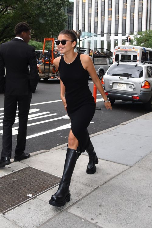 Zendaya seen in High Slit Black Dress With Long Boots In New York City
