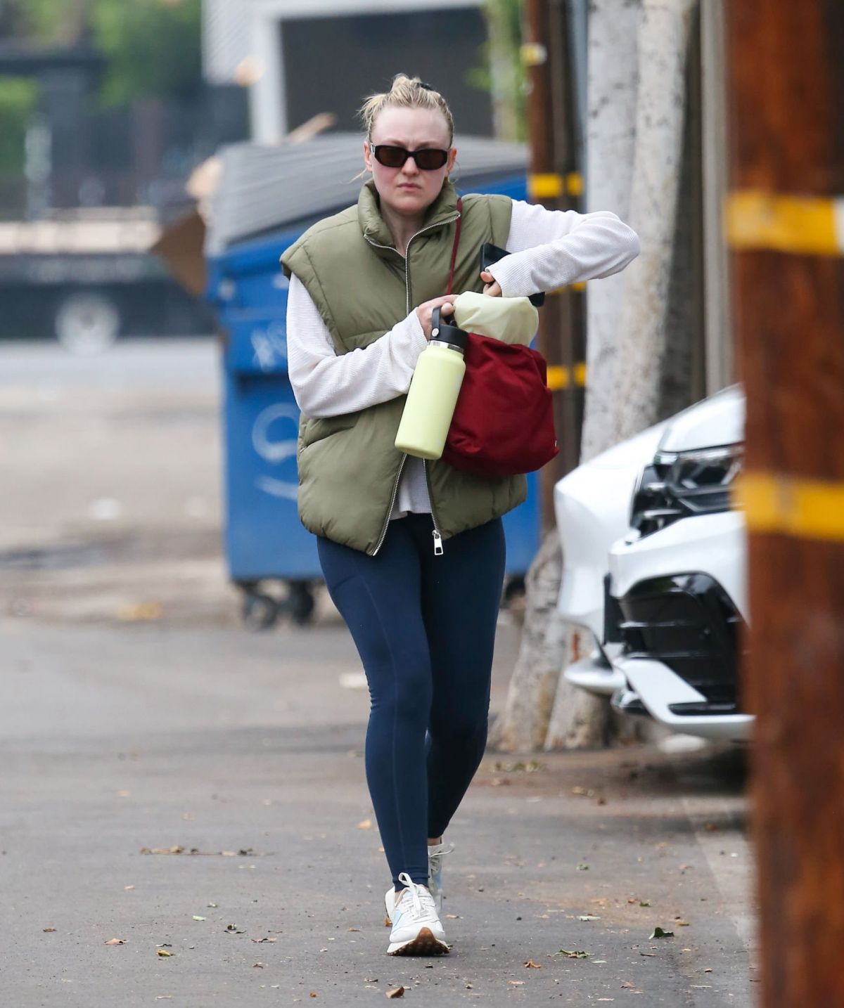 Dakota Fanning in Puffer Jacket and Tights Day Out in Los Angeles, Oct 2022