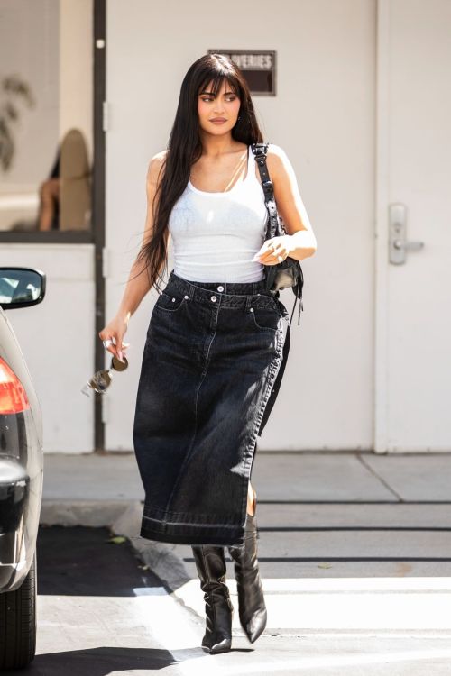 Kylie Jenner Leaves an Office Building in White Top and Black Denim Skirt in Calabasas, Sep 2022