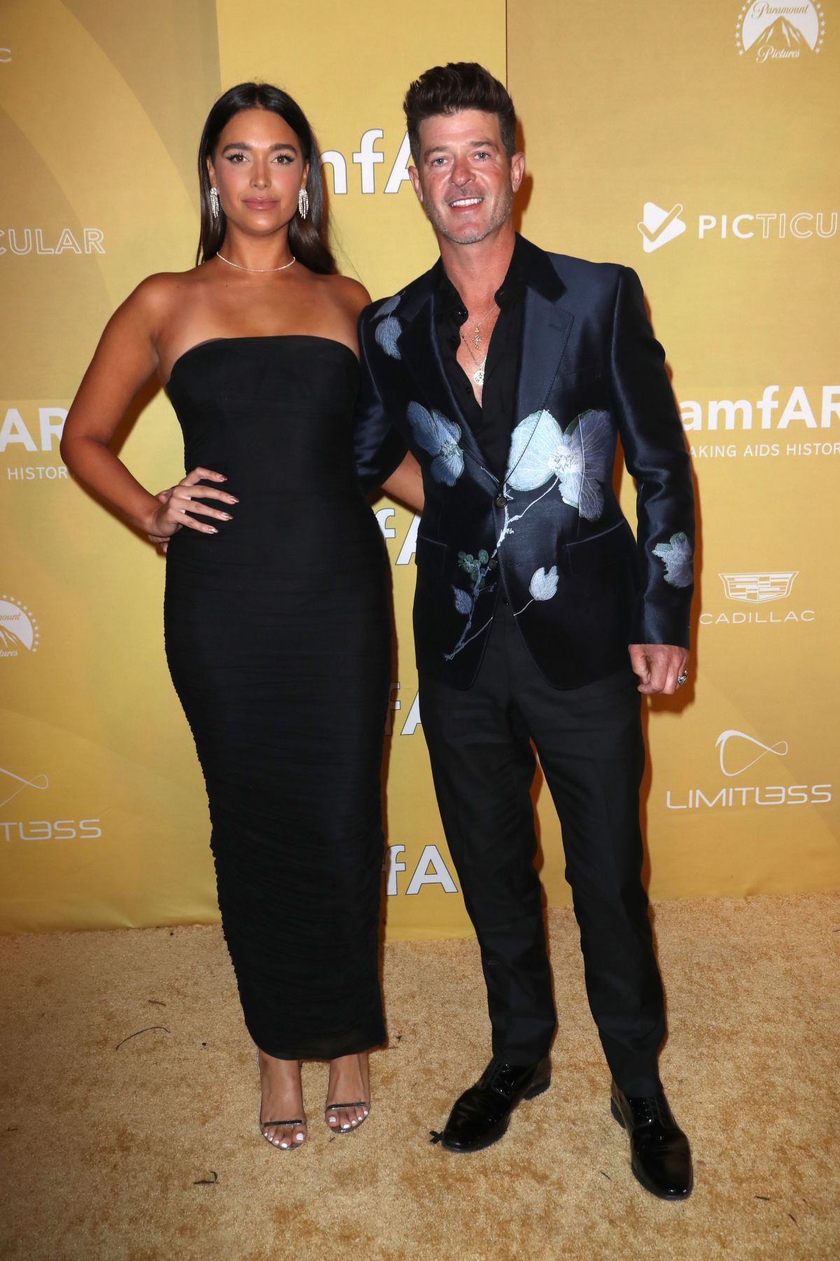 April Love Geary and Robin Thicke attends amfAR Gala Los Angeles 2022 in West Hollywood