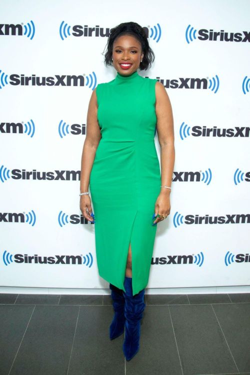 Jennifer Hudson in long blue jacket with long boots