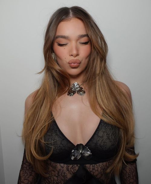 Bumblebee actress Hailee Steinfeld celebrity photoshoot, pouting and wearing crossbody minidress, silver necklace and wavy hair