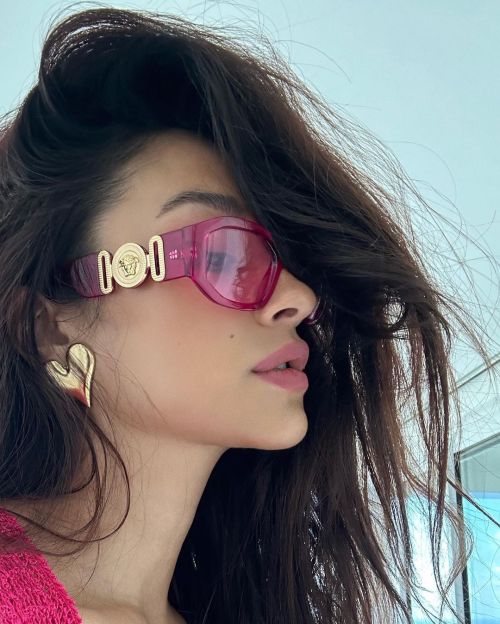 Shay Mitchell Poses in Pink Dress with Golden Sandles at Sea Side, Jan 2023