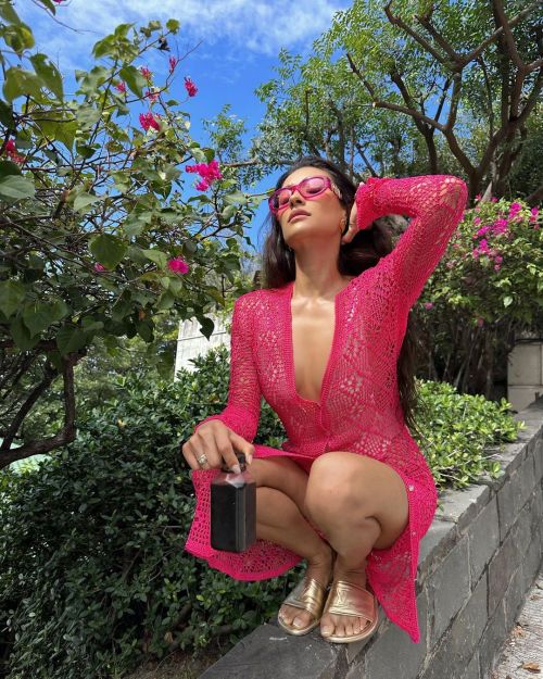 Shay Mitchell Poses in Pink Dress with Golden Sandles at Sea Side, Jan 2023