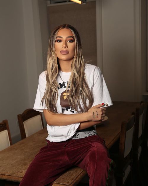 Demi Sims poses in White Top and Red Pajama Photos, Feb 2023