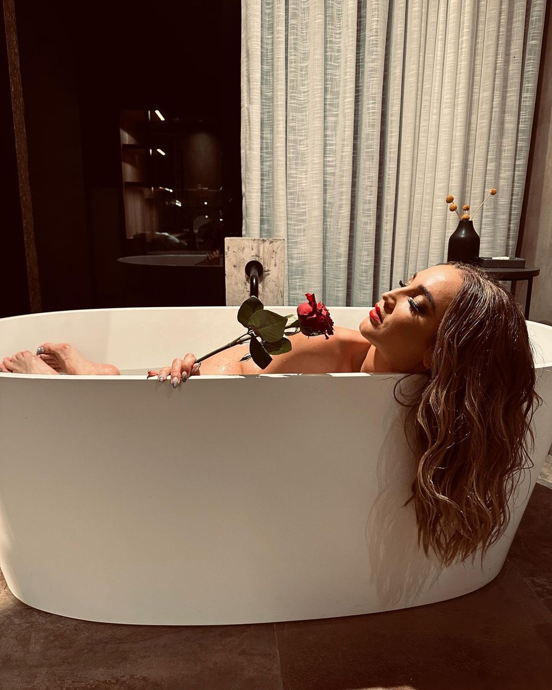 Olga Buzova Poses in Bath Tub with Red Rose during Photoshoot, Feb 2023